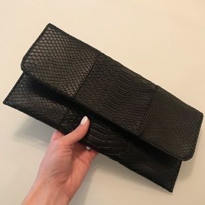 Black snakeskin clutch